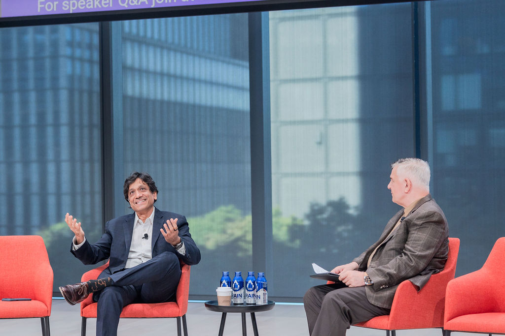 Arun Sundararajan, professor at New York University (left) and Peter Miscovich, global future-of-work leader at JLL (right) in discussion.